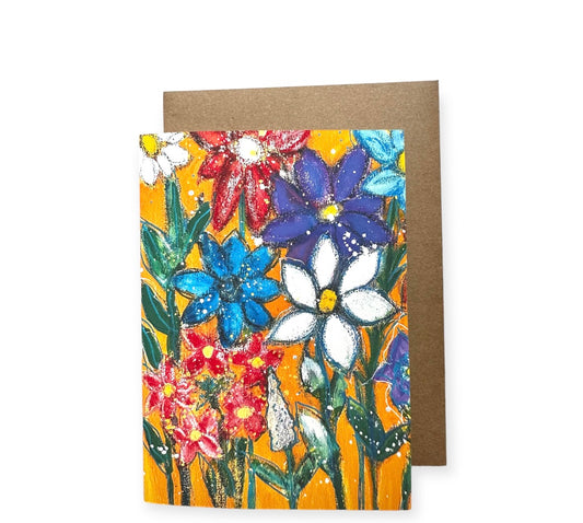 Greeting card, with blank space inside. Printed in reclaimed paper, acid free and recyclable. Orange background with wild flowers painted with layers so there is dimension. Card is 5 by 7 inches comes with a recycled kraft paper envelope.