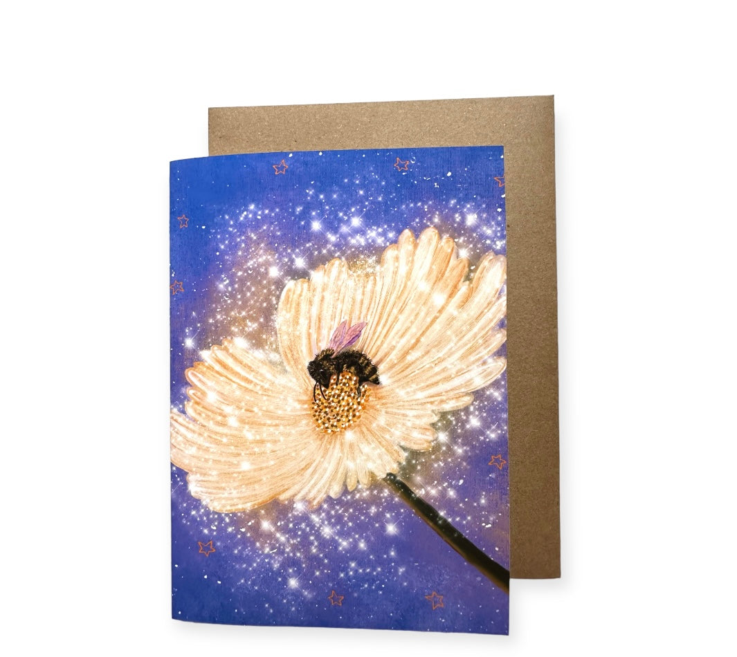 Are you a bee lover, well this card is for you. It has a flower blooming with a yellow and creamy color, and it is full of pollen and glistening starts, almost looks like fairy dust and tin the middle there is a bee. Measures 5 inches  by 7 inches. Comes in acid free recyclable paper with a recycle paper envelope.